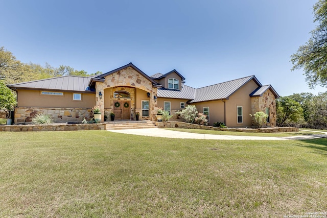 view of front of house with a standing seam roof, metal roof, and stone siding
