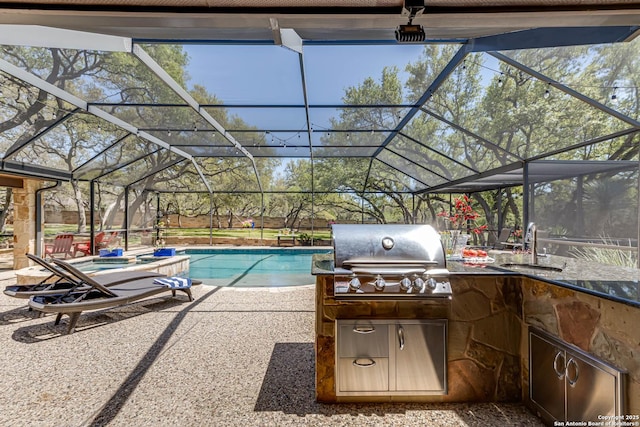 view of patio with an outdoor kitchen, glass enclosure, grilling area, a sink, and an outdoor pool