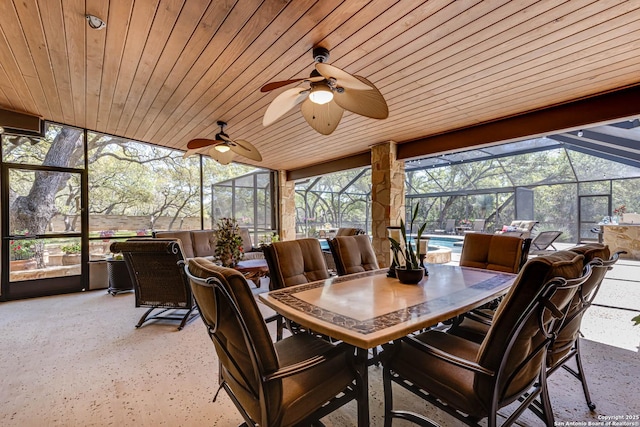 sunroom / solarium featuring outdoor dining space and a ceiling fan