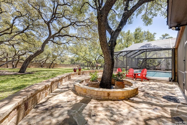 view of patio / terrace with an outdoor pool and a lanai