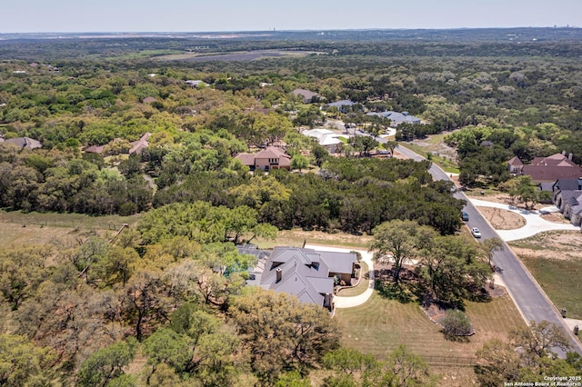 bird's eye view featuring a forest view