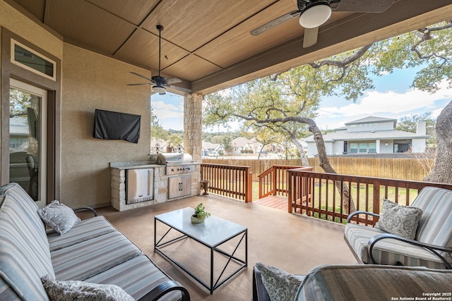 exterior space featuring a grill, a residential view, outdoor lounge area, and fence
