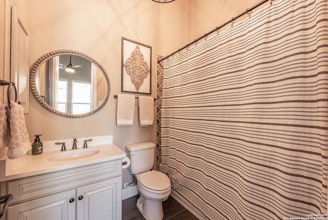 full bathroom with tile patterned flooring, vanity, and toilet