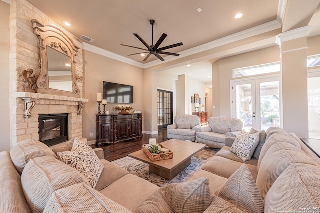 living room featuring french doors, ceiling fan, wood finished floors, and visible vents