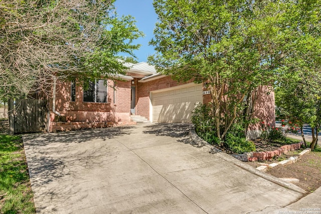 10 Oakwell Farms Pkwy, San Antonio, TX 78218 - view of front of property featuring brick siding, driveway, and an attached garage