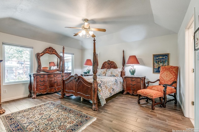 10 Oakwell Farms Pkwy, San Antonio, TX 78218 - bedroom featuring ceiling fan, wood finish floors, vaulted ceiling, and baseboards