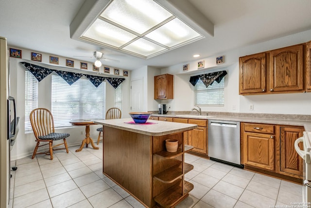 10 Oakwell Farms Pkwy, San Antonio, TX 78218 - kitchen with a sink, light tile patterned floors, light countertops, and dishwasher
