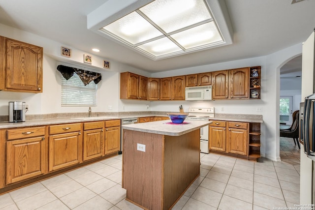10 Oakwell Farms Pkwy, San Antonio, TX 78218 - kitchen with a sink, light countertops, white appliances, and brown cabinets