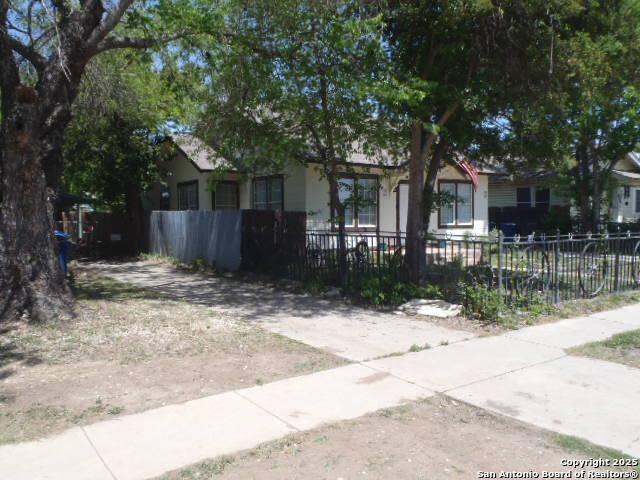 335 Hot Wls, San Antonio, TX 78223 - view of front of house with fence private yard and stucco siding