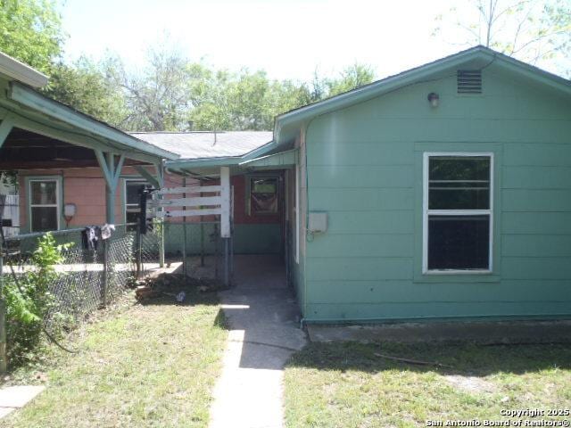 335 Hot Wls, San Antonio, TX 78223 - view of home's exterior featuring a yard and fence