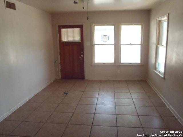 335 Hot Wls, San Antonio, TX 78223 - interior space with light tile patterned floors, visible vents, a ceiling fan, and baseboards