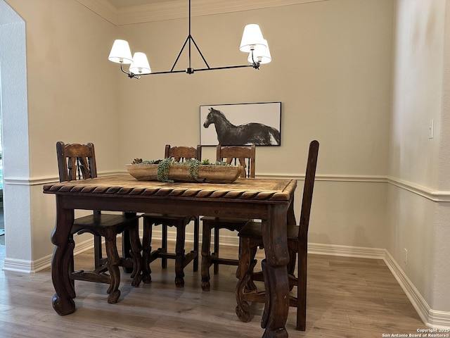 23407 Treemont Park, San Antonio, TX 78261 - dining area featuring a chandelier, ornamental molding, and wood finished floors