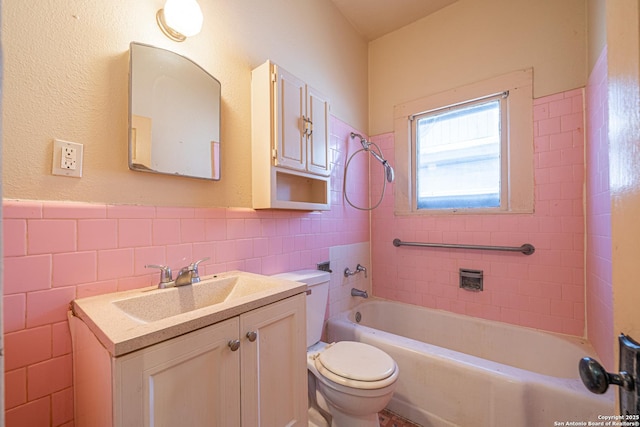 full bathroom with shower / bathtub combination, vanity, toilet, wainscoting, and tile walls