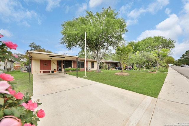 307 Trudell, San Antonio, TX 78213 - ranch-style house with concrete driveway, a front yard, and a carport