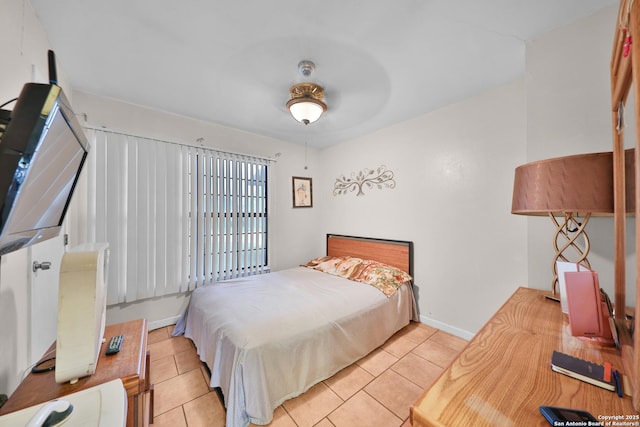 307 Trudell, San Antonio, TX 78213 - bedroom featuring baseboards and light tile patterned flooring