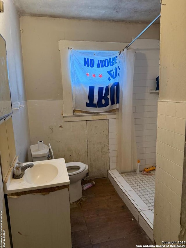 1915 Pasadena St, San Antonio, TX 78201 - full bath featuring vanity, a stall shower, toilet, and wood finished floors