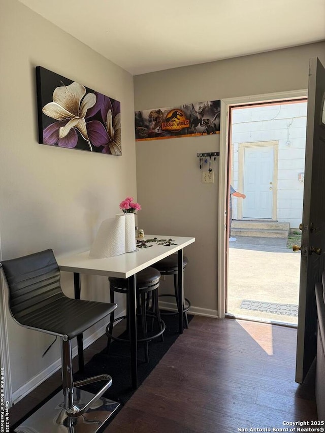 1915 Pasadena St, San Antonio, TX 78201 - dining space featuring baseboards and wood finished floors