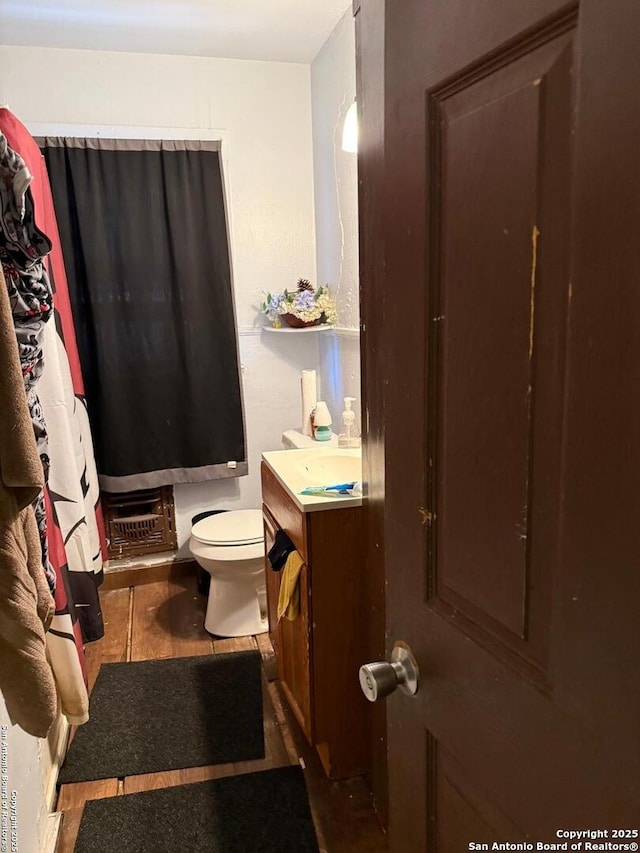 1915 Pasadena St, San Antonio, TX 78201 - bathroom featuring tile patterned floors, toilet, and vanity