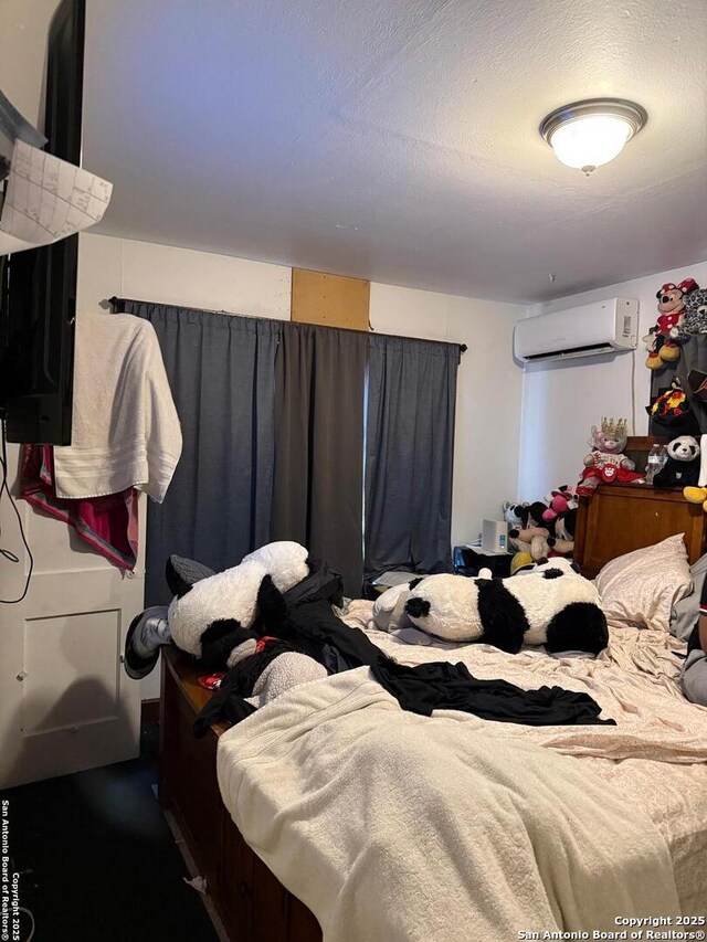 1915 Pasadena St, San Antonio, TX 78201 - bedroom with a wall mounted AC
