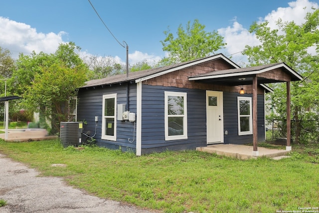 1360 Essex, San Antonio, TX 78210 - view of front of house featuring cooling unit, a patio, and a front yard