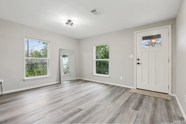 1360 Essex, San Antonio, TX 78210 - foyer entrance with visible vents, baseboards, and wood finished floors
