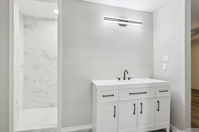 1360 Essex, San Antonio, TX 78210 - full bath with baseboards, a shower stall, vanity, and a textured wall