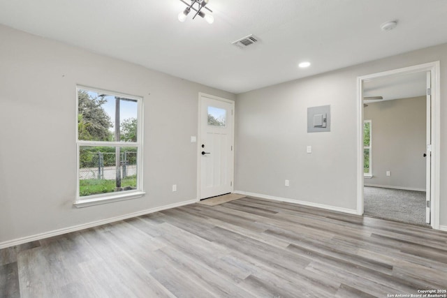 1360 Essex, San Antonio, TX 78210 - foyer featuring wood finished floors, baseboards, and visible vents