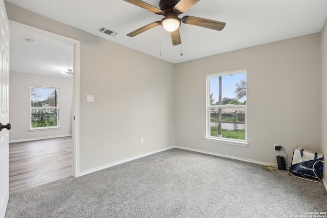 1360 Essex, San Antonio, TX 78210 - unfurnished room with ceiling fan, baseboards, carpet flooring, and visible vents