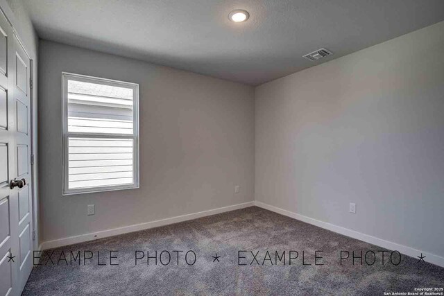 4731 Sahara Vlys, San Antonio, TX 78222 - spare room featuring carpet flooring, baseboards, and visible vents
