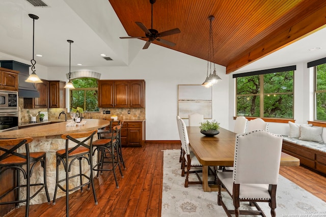 dining area featuring recessed lighting, lofted ceiling, dark wood-style floors, visible vents, and a ceiling fan