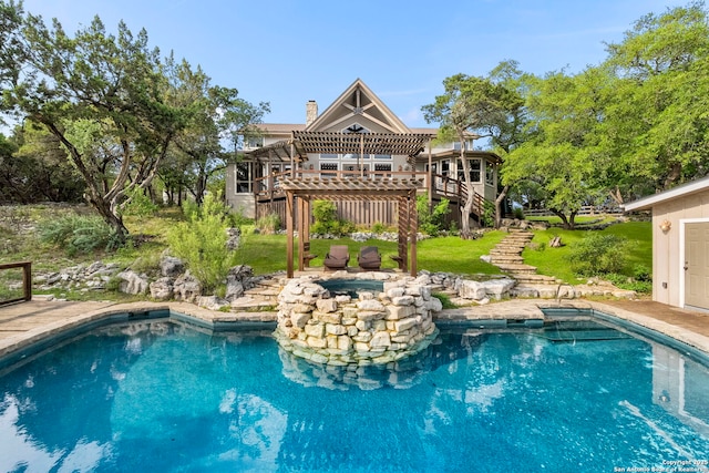 pool with a lawn, a wooden deck, and stairway