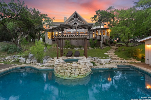 outdoor pool featuring a yard, stairs, a hot tub, and a deck