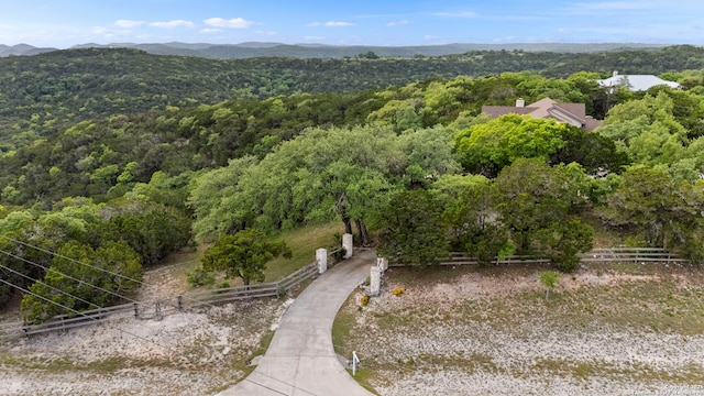 birds eye view of property with a view of trees
