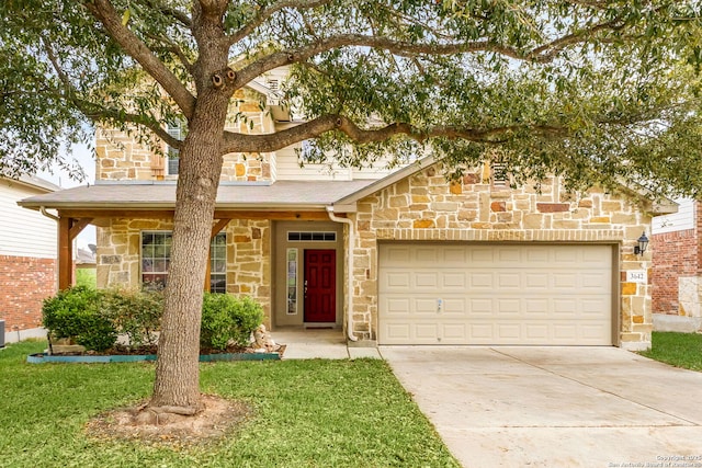 view of front of home with an attached garage, concrete driveway, a front yard, and stone siding