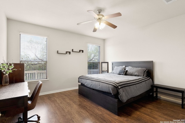 bedroom with wood finished floors, baseboards, and a ceiling fan