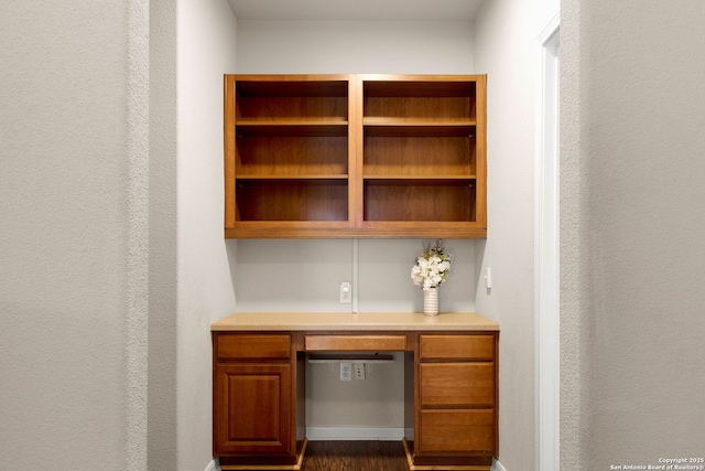 unfurnished office featuring built in study area