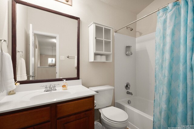bathroom with vanity, shower / bath combination with curtain, and toilet
