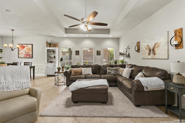 4 Andover Creek Dr, San Antonio, TX 78254 - living area with a ceiling fan, light tile patterned floors, a chandelier, and a tray ceiling