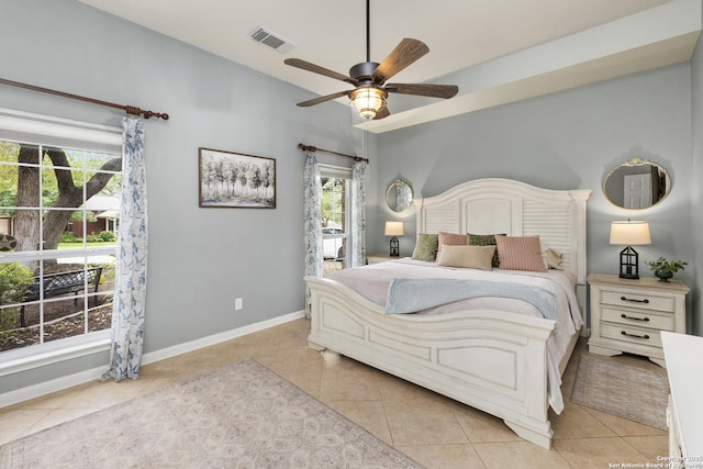 4 Andover Creek Dr, San Antonio, TX 78254 - bedroom featuring multiple windows, light tile patterned flooring, a ceiling fan, baseboards, and lofted ceiling