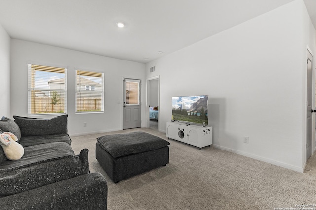 7415 Cheetah Pass, San Antonio, TX 78253 - living room featuring visible vents, baseboards, and light carpet