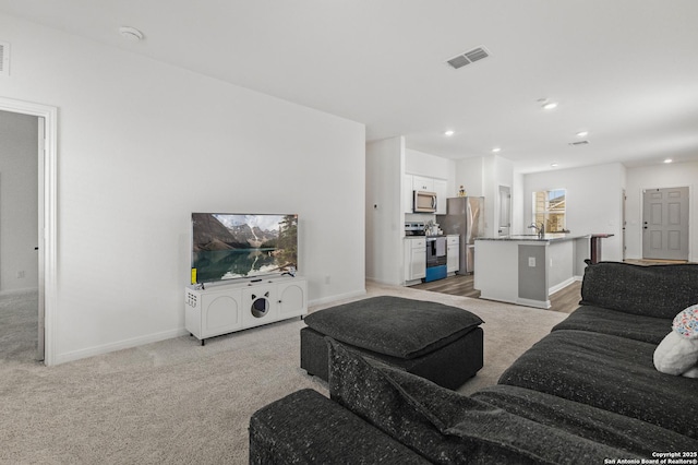 7415 Cheetah Pass, San Antonio, TX 78253 - living area with light colored carpet, baseboards, visible vents, and recessed lighting