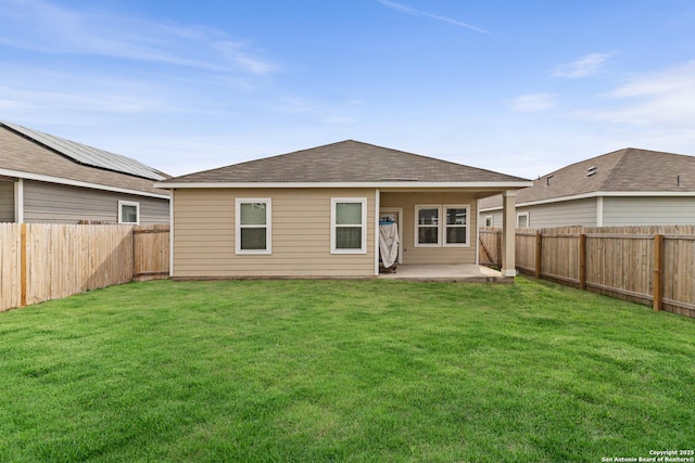 7415 Cheetah Pass, San Antonio, TX 78253 - rear view of house with a fenced backyard, a patio, a lawn, and roof with shingles