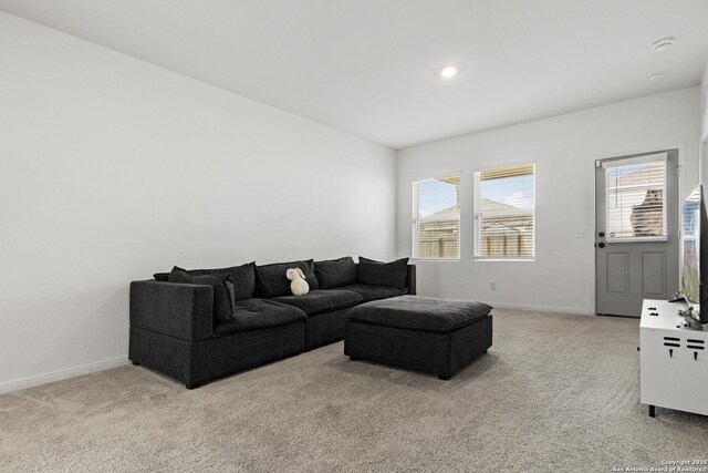 7415 Cheetah Pass, San Antonio, TX 78253 - living area featuring plenty of natural light, light colored carpet, and baseboards