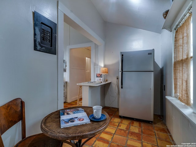 kitchen featuring freestanding refrigerator