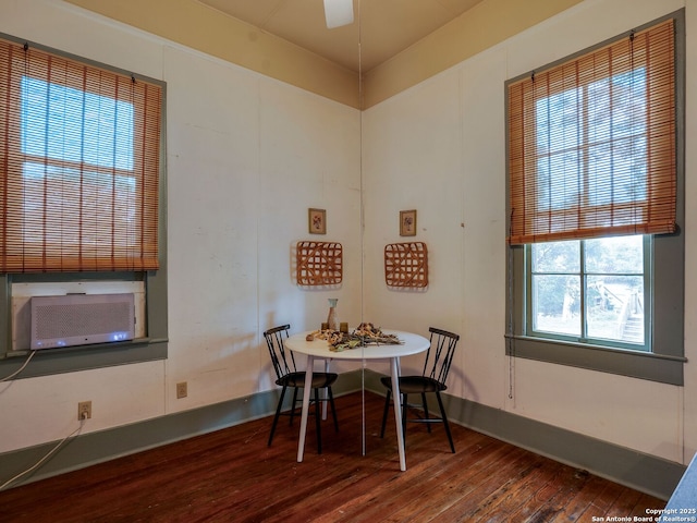 dining room with cooling unit and hardwood / wood-style flooring
