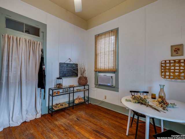 interior space featuring wood finished floors and cooling unit