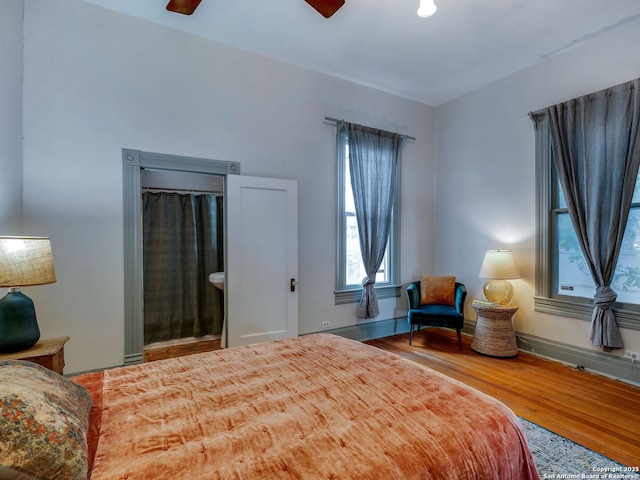 bedroom with a ceiling fan and wood finished floors