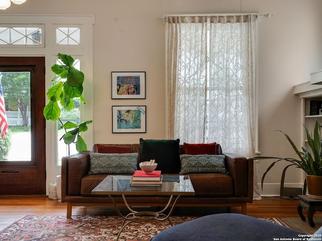 interior space with a healthy amount of sunlight and wood finished floors