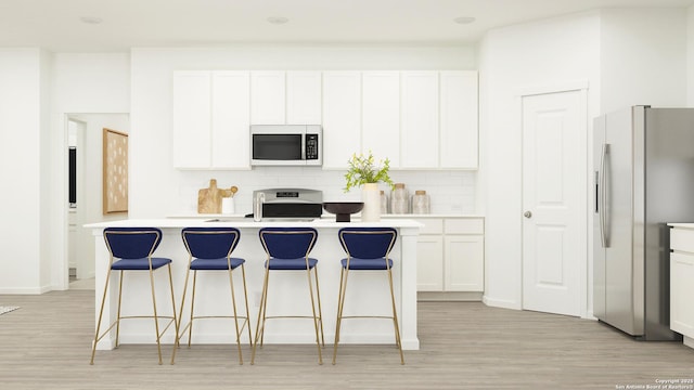 15110 Brandy Gln, San Antonio, TX 78253 - kitchen featuring tasteful backsplash, a kitchen breakfast bar, stainless steel microwave, refrigerator with ice dispenser, and range