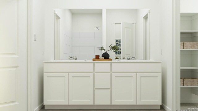 15110 Brandy Gln, San Antonio, TX 78253 - bathroom featuring a sink, double vanity, and baseboards